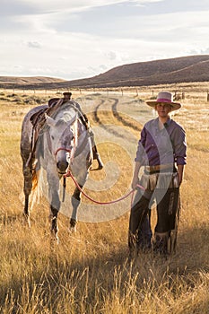 Beautiful Cowgirl With Horse photo