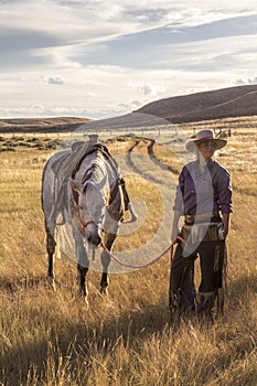 Beautiful Cowgirl With Horse photo