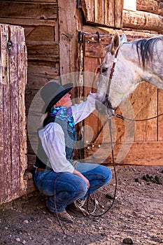 Beautiful Cowgirl in Western Scene photo