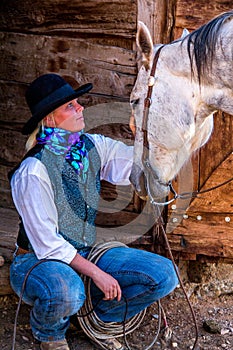Beautiful Cowgirl in Western Scene photo