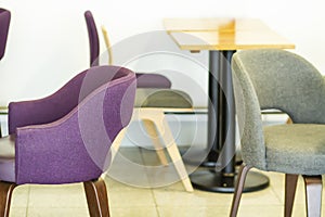 Beautiful cozy armchairs in interior of cafe. Chairs and tables in cafe. Upholstered furniture in restaurant.