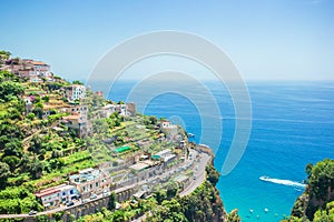 Beautiful cozy bay with boats and clear turquoise water in Italy