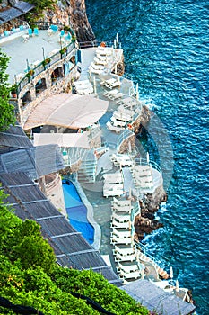 Beautiful cozy bay with boats and clear turquoise water in Italy