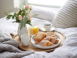 Beautiful cozy breakfast in bed, home bedroom interior with bright morning light, healthy food on decorated tray