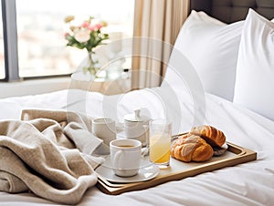 Beautiful cozy breakfast in bed, home bedroom interior with bright morning light, healthy food on decorated tray