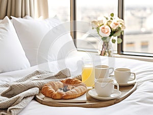 Beautiful cozy breakfast in bed, home bedroom interior with bright morning light, healthy food on decorated tray