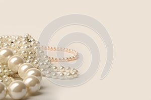 Beautiful cream wedding pearl necklaces on a white background