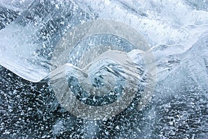 Beautiful crystal blue ice with bubbled structure