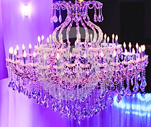 Beautiful Crystal Chandelier. Close up on the crystal of a contemporary crystal decoration. Luxury luster in the banquet hall. Gr photo