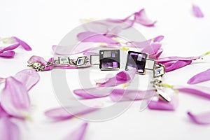 Beautiful crystal earings with lila petals photo