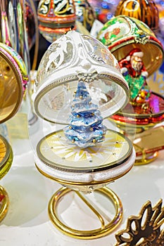 Beautiful crystal Faberge egg with blue christmas tree inside