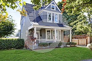 Beautiful curb appeal. American house with well kept front yard.