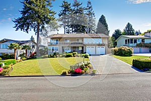 Beautiful curb appeal of two story house with beige exterior paint.