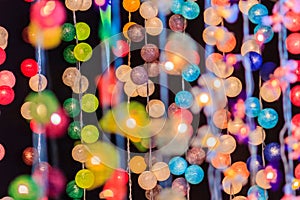 Beautiful curtain line of LED lighting with bokeh at night. Abstract line of LED light bokeh defocused background. Colorful decor