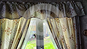 Beautiful curtain on the window and transparent tulle curtain. Abstract background, texture, pattern. Space for text and