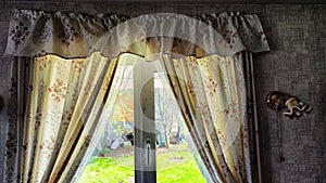 Beautiful curtain on the window and transparent tulle curtain. Abstract background, texture, pattern. Space for text and