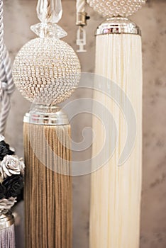 Beautiful curtains accessory. Close up of tassels for curtain