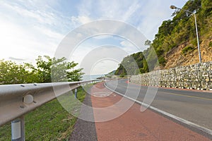 Beautiful curve road by the sea and mountain at Noen-nangphaya view point in Chanthaburi, Thailand.