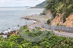 Beautiful curved road of Chalerm burapa chollathit road or scenic route beside the sea at Chanthaburi, Thailand