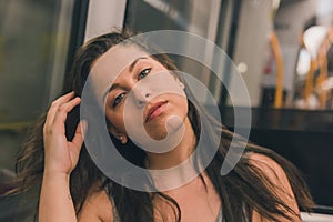 Beautiful curvy girl posing in a metro car