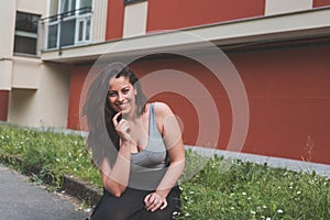 Beautiful curvy girl sitting in the grass