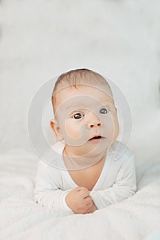 Beautiful cute laughing baby. Boy or girl on white. Little child