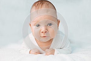 Beautiful cute laughing baby. Boy or girl on white. Little child