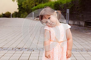 Beautiful cute little girl with sad face