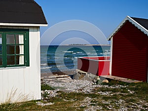 Beautiful cute little wooden beach huts summer houses, painted in lively colors, Aero Island, South Funen, Denmark