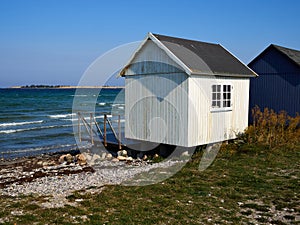 Beautiful cute little wooden beach huts summer houses, painted in lively colors, Aero Island, South Funen, Denmark