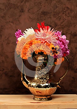 Beautiful dahlia and marigold flowers in a vase, abstract floral arrangement, autumn background with space for text, minimal
