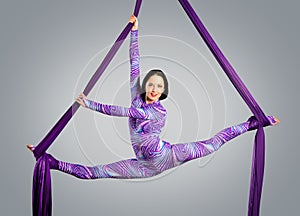 Beautiful dancer on aerial silk, aerial contortion, aerial ribbons, aerial silks, aerial tissues, fabric