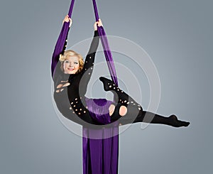 Beautiful dancer on aerial silk, aerial contortion, aerial ribbons, aerial silks, aerial tissues, fabric, ribbon