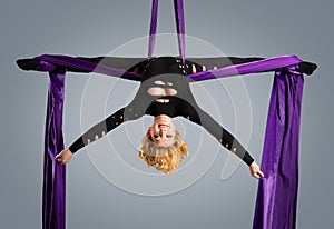 Beautiful dancer on aerial silk, aerial contortion, aerial ribbons, aerial silks, aerial tissues, fabric, ribbon