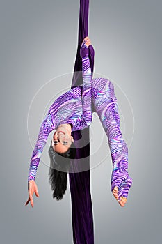 Beautiful dancer on aerial silk, aerial contortion, aerial ribbons, aerial silks, aerial tissues, fabric photo