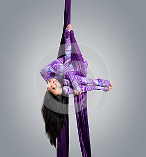 Beautiful dancer on aerial silk, aerial contortion, aerial ribbons, aerial silks, aerial tissues, fabric photo