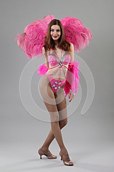 Beautiful dancer posing on studio background