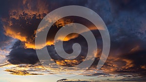 Dark cloudscape at sunset with red clouds