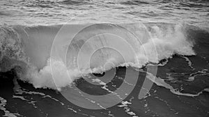 Beautiful dark dramatic toned fine art seascape image of breaking waves on Atlantic Ocean in Devon England