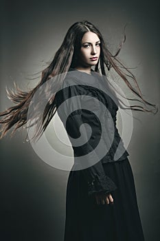 Beautiful dark girl with long flying hair