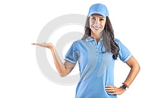 Beautiful dark-haired woman in blue cap and t-shirt holding her hand up like holding something. Isolated background