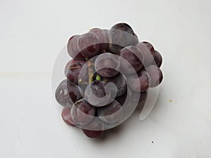 Beautiful dark red and black color grape fruits bunch  on white background