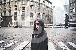 Beautiful dark vampire woman with black mantle and hood