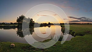 Beautiful dawn landscape image of River Thames at Lechlade-on-Thames