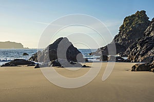 Beautiful dawn landscape over Kynance Cove in Cornwall England with vibrant sky and beautiful turquoise ocean