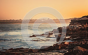 Beautiful dawn sky overlooking the ocean and Maroubra rock pool. Sydney, Australia