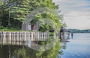 A beautiful day in a boat at five sea, old cottage and boathouse