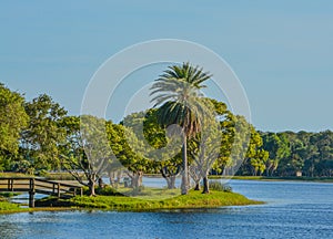 A beautiful day for a walk and the view of the wood bridge to the island at John S. Taylor Park in Largo, Florida.