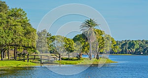 A beautiful day for a walk and the view of the wood bridge to the island at John S. Taylor Park in Largo, Florida. photo