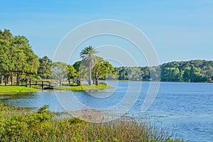 A beautiful day for a walk and the view of the wood bridge to the island at John S. Taylor Park in Largo, Florida.